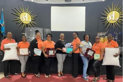 Women in Bahamas receive personal care and hygiene packages donated by Teachers union