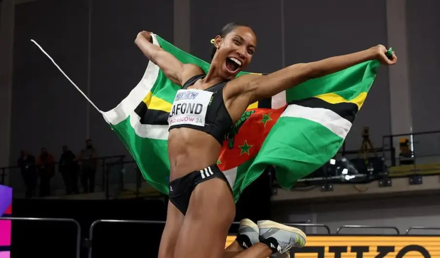 Thea Lafond receiving a warm welcome from Minister Melissa Skerrit upon her return to Dominica.