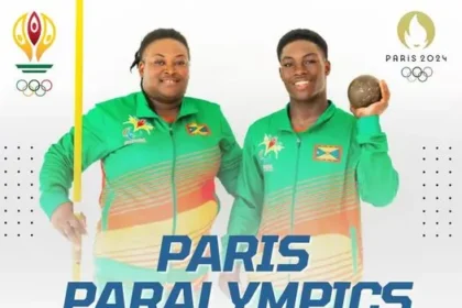 Grenadian Paralympic athletes Ishona Charles and Tyler Smith posing with their national flag.