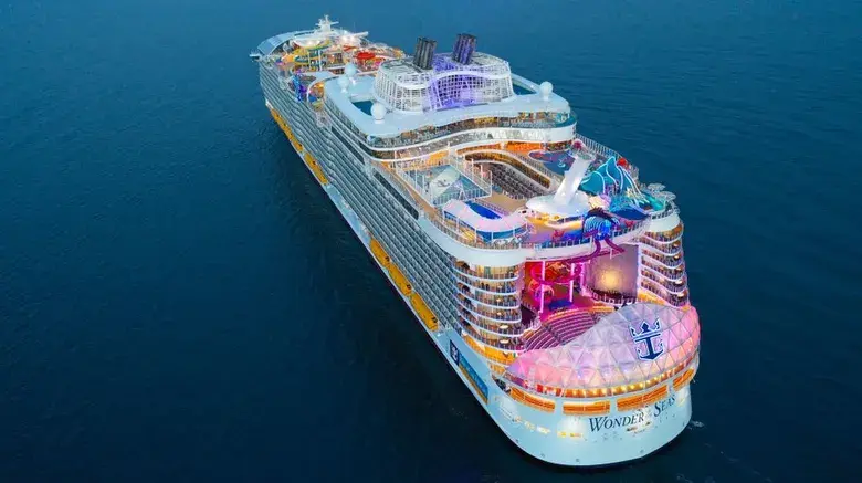 Wonders of Seas cruise ship docked in Grenada, showcasing its impressive size and amenities.