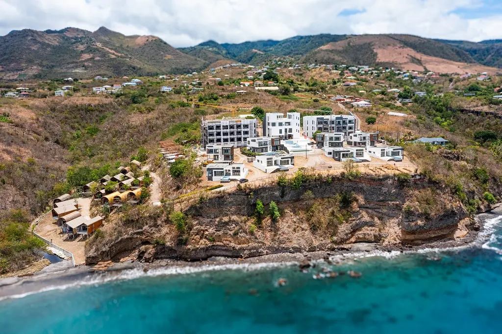 Rendering of Tranquility Beach Resort in Dominica, showcasing eco-friendly villas and scenic views.