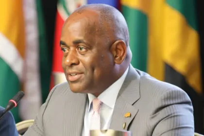 Prime Minister Roosevelt Skerrit welcoming Dwayne Cenac as the new DOMLEC General Manager.