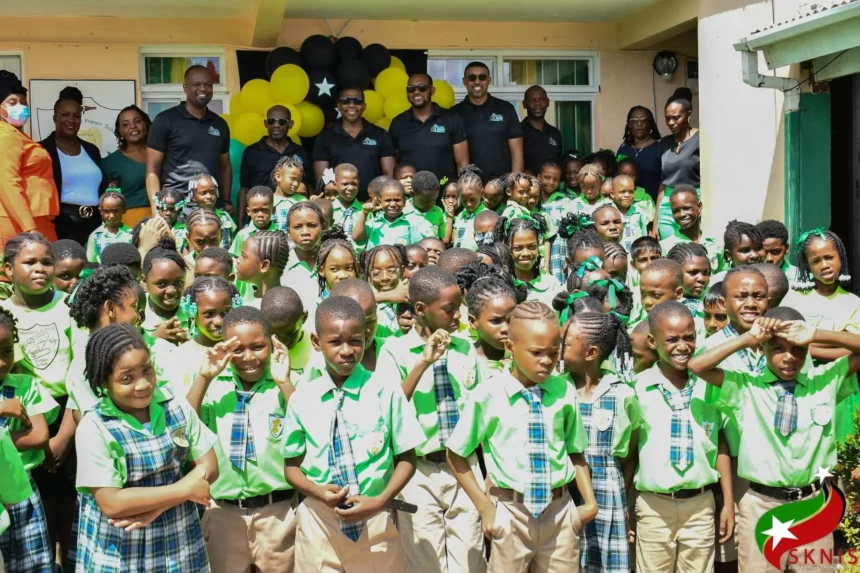 Prime Minister Dr. Terrance Drew interacting with students during school visits ahead of Independence Day.