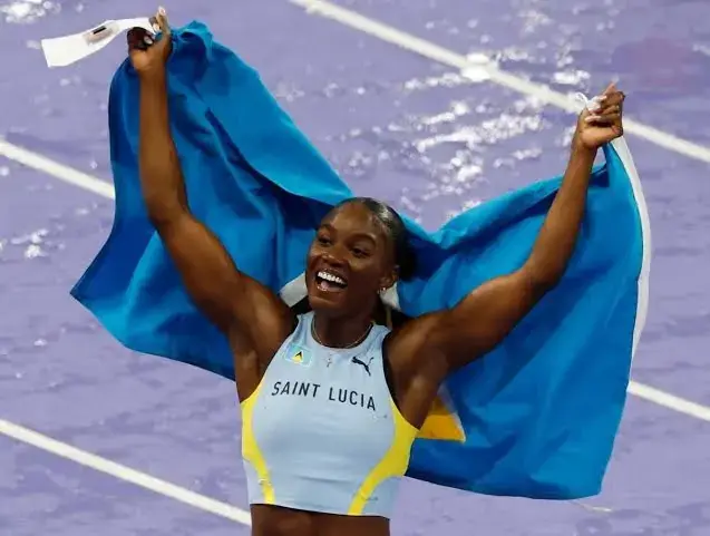 Julien Alfred celebrating her historic season with her prize money.