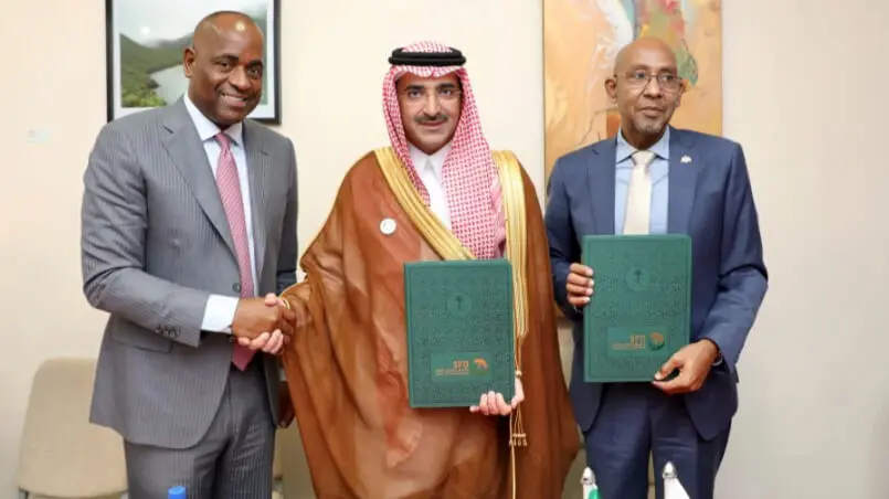 Signing ceremony for the Roseau Enhancement Project loan agreement.