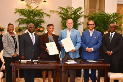Prime Minister Philip Davis and investors signing the $350 million agreement for the Bahamas.