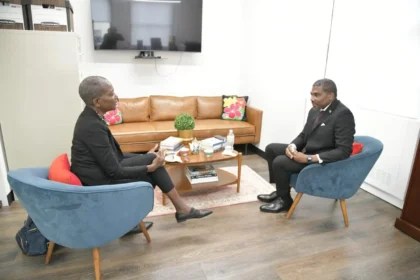 Prime Minister Terrance Drew congratulates Leslie Wade on her appointment as Permanent Observer to the UN.